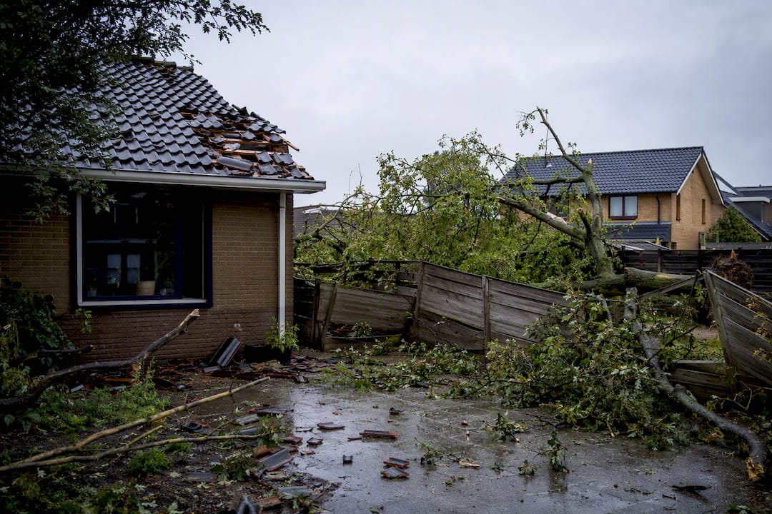 Storm damage on rental property roof and gutter